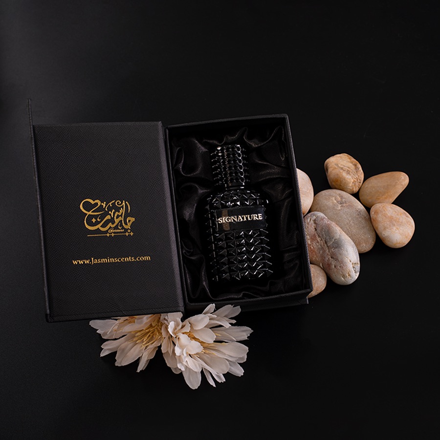 Signature cologne in its black and gold Jasmin Scents box